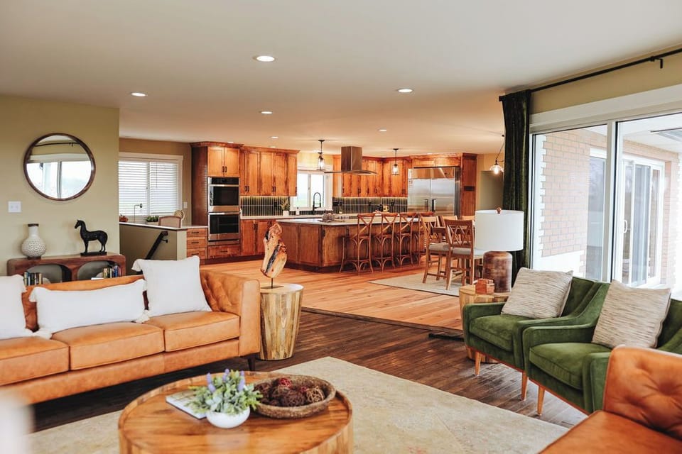Open concept kitchen and dining space visible from living room. 