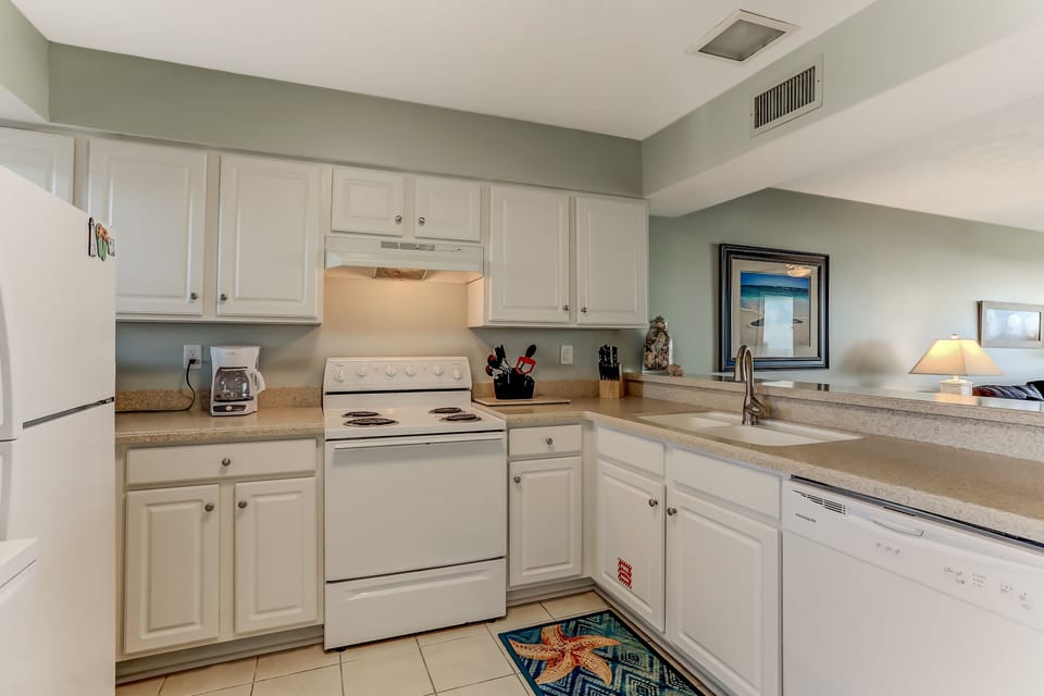Spacious and well stocked kitchen.