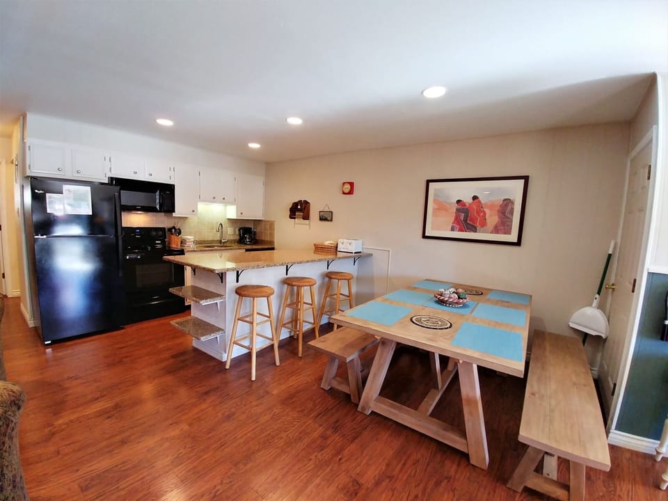 Step into your fully equipped kitchen and dining area, where you can whip up meals and gather around the table for cozy dinners or morning coffee with loved ones.