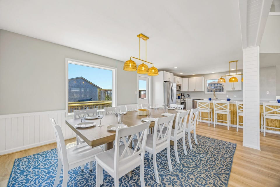 Step into your bright, open dining space where family meals become cherished memories. The elegant table seats everyone comfortably.