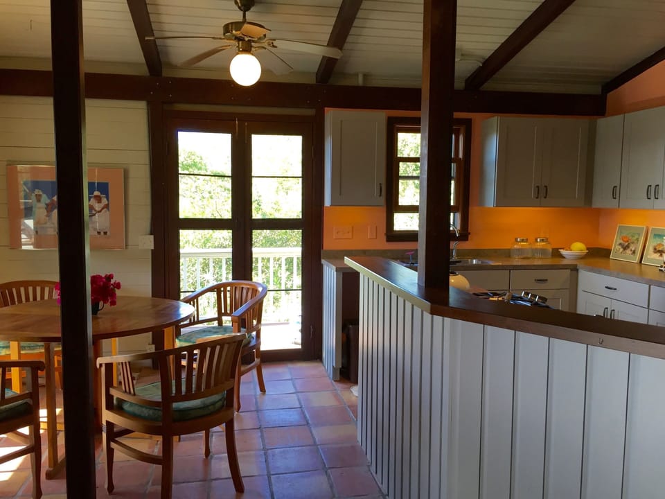 Kitchen and Dining Area with screen doors all around.