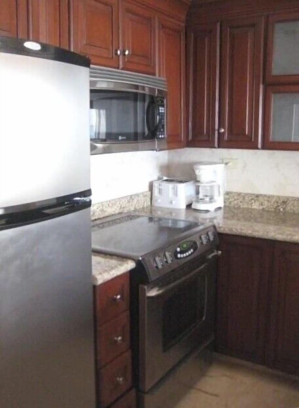 Remodeled kitchen with stainless appliances, new cabinetry and granite 