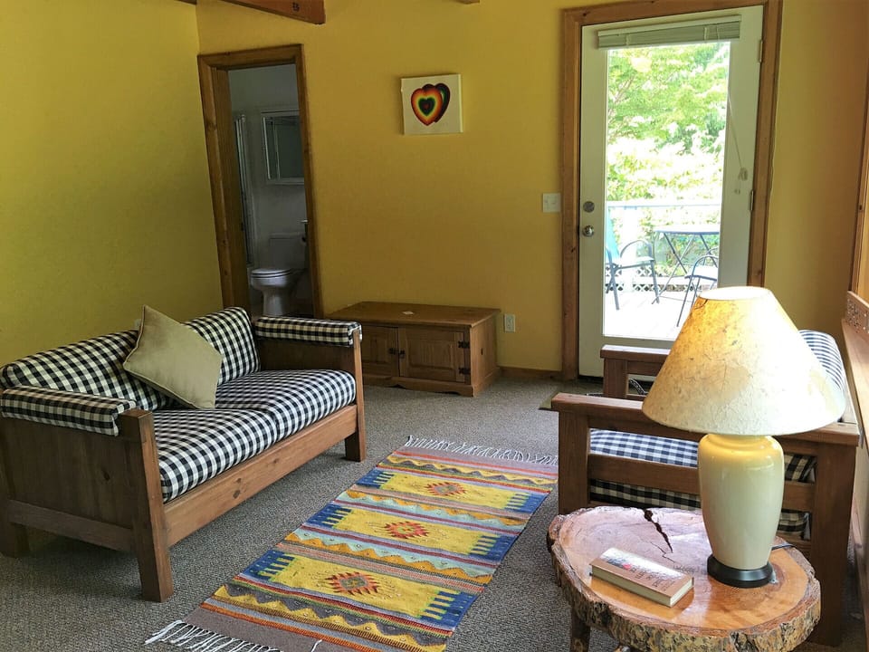 Another view of the sitting area in downstaris bedroom - bathroom behind it.
