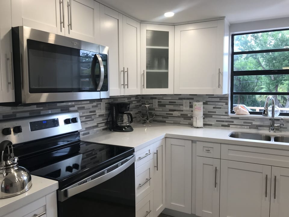 Stainless steel appliances full kitchen equipped for home cooked meals.