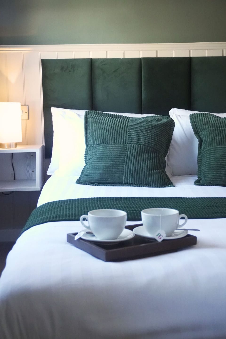 Desk, iron/ironing board, bed sheets