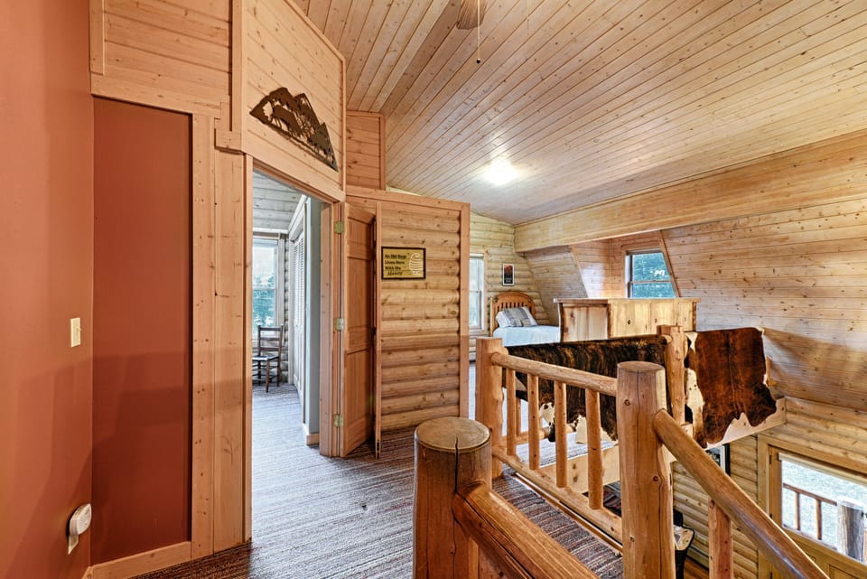 Master bedroom entrance and loft bedroom to the right (on top level)