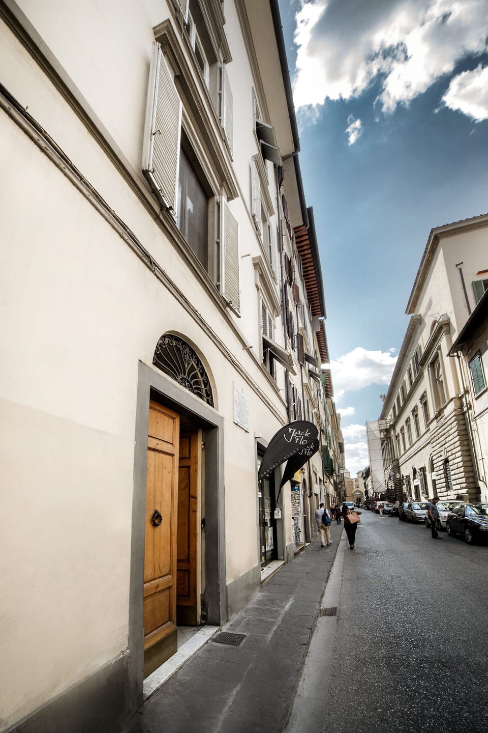 View of the entrance of the building and of the street called "Via Ghibellina"
