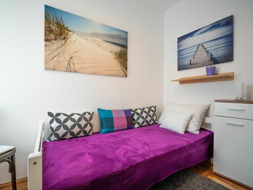 Furniture, Property, Comfort, Picture Frame, Interior Design, Purple, Cabinetry, Textile, Wood, Floor
