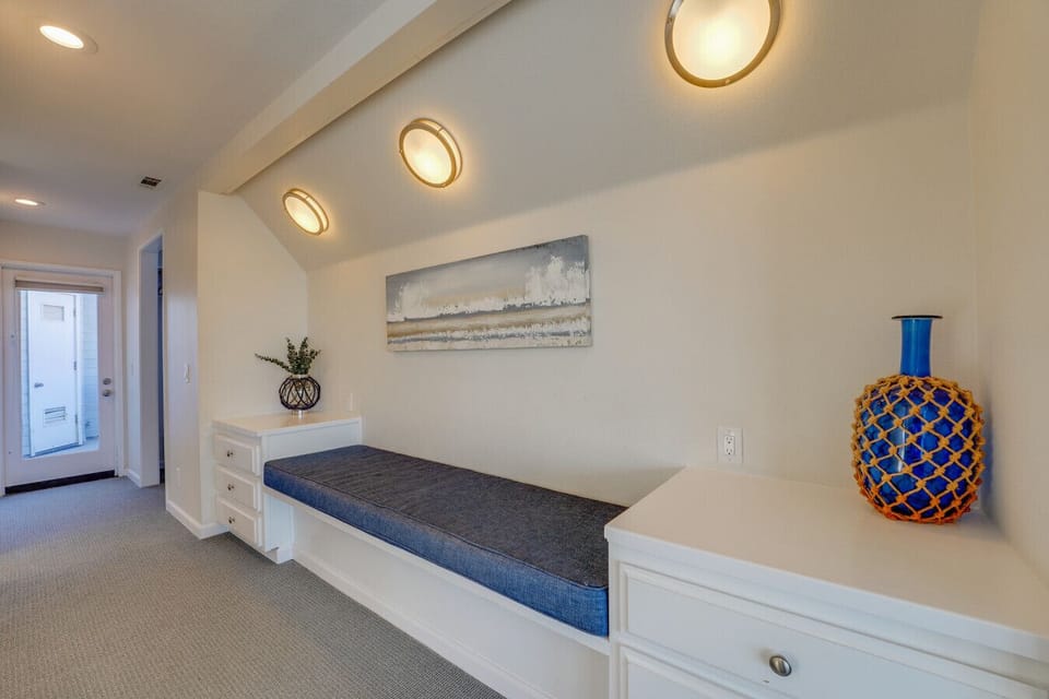 The hall way in the primary suite has THREE closets and a bench seat!Front Unit: