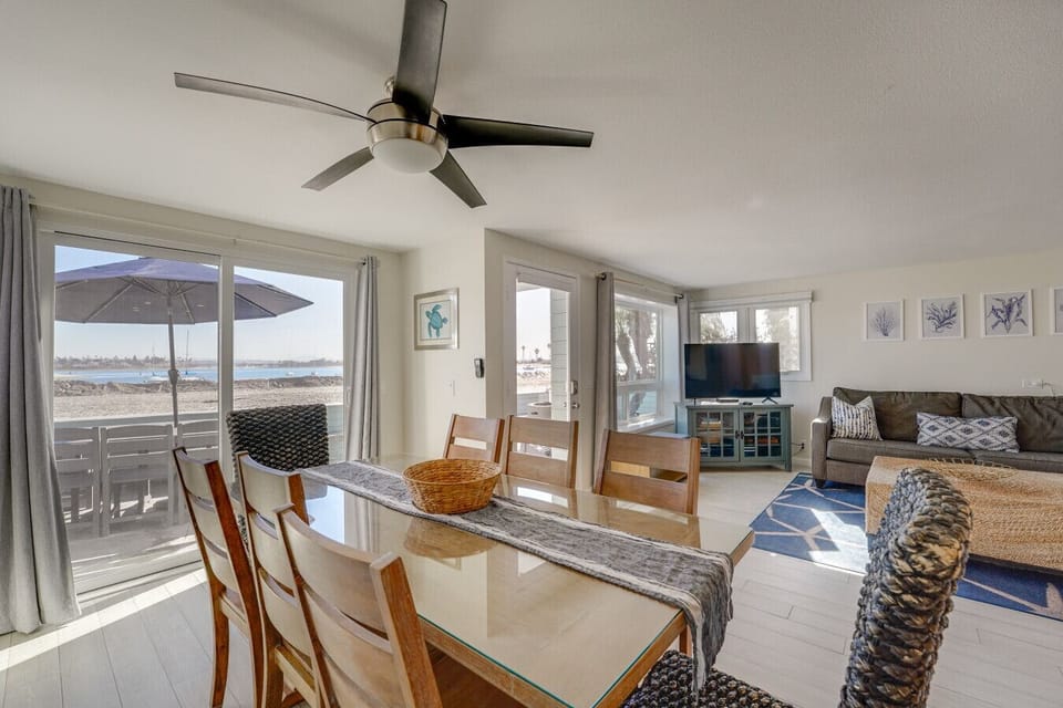 The slider off the dining table opens up to more dining outside! Let the coastal breeze in!