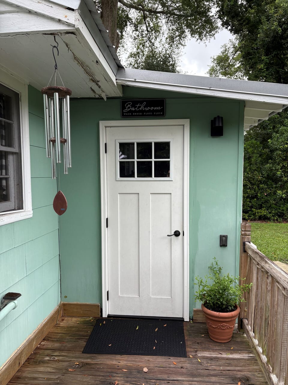 Entrance to laundry and half bath off the deck 