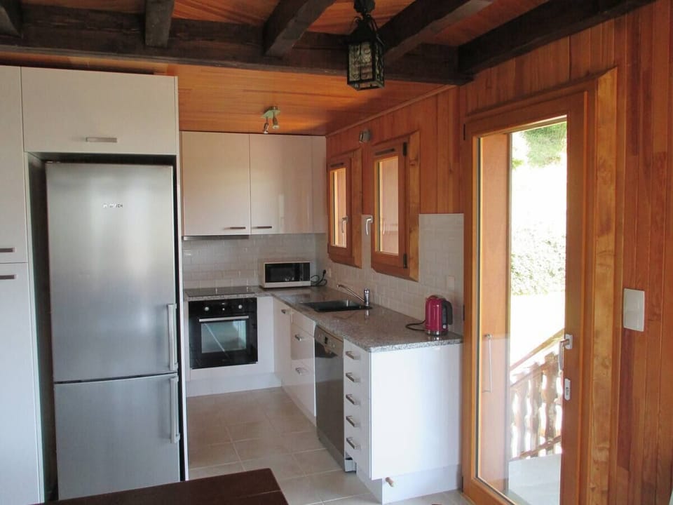 Modern kitchen with granite bench tops.