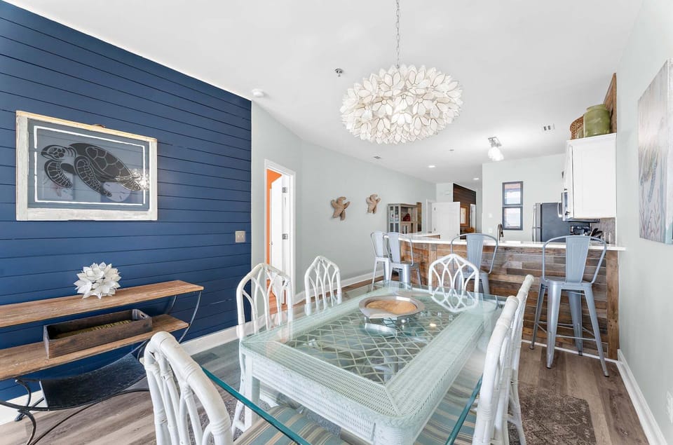 Dining table with seating for six plus 3 additional bar seats.