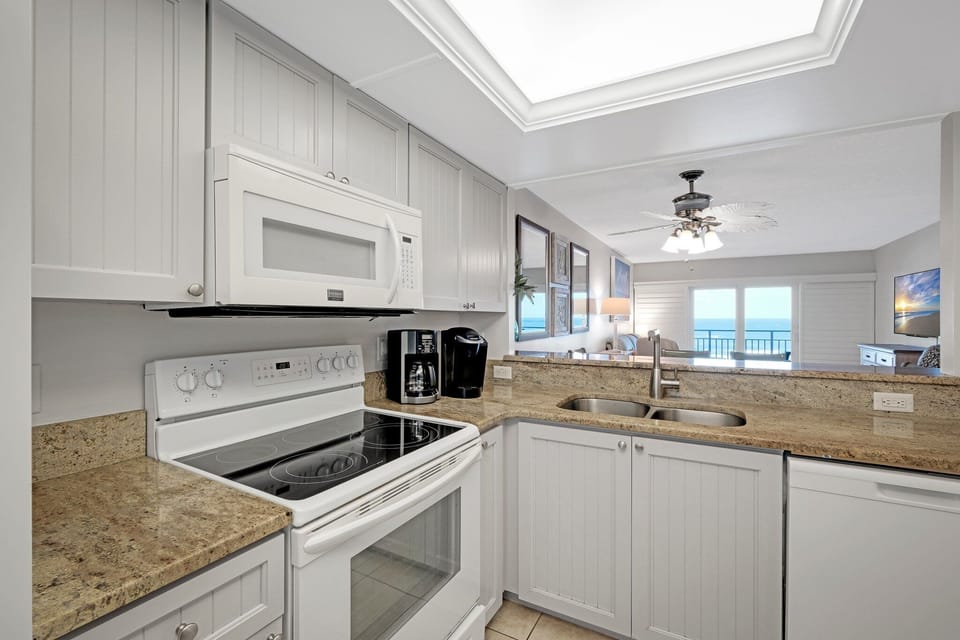 Cook in style with granite countertops and enjoy stunning ocean views right from the kitchen