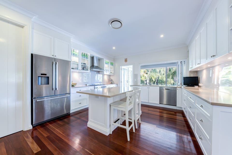 The kitchen with bi-fold windows out to the entertaining area
