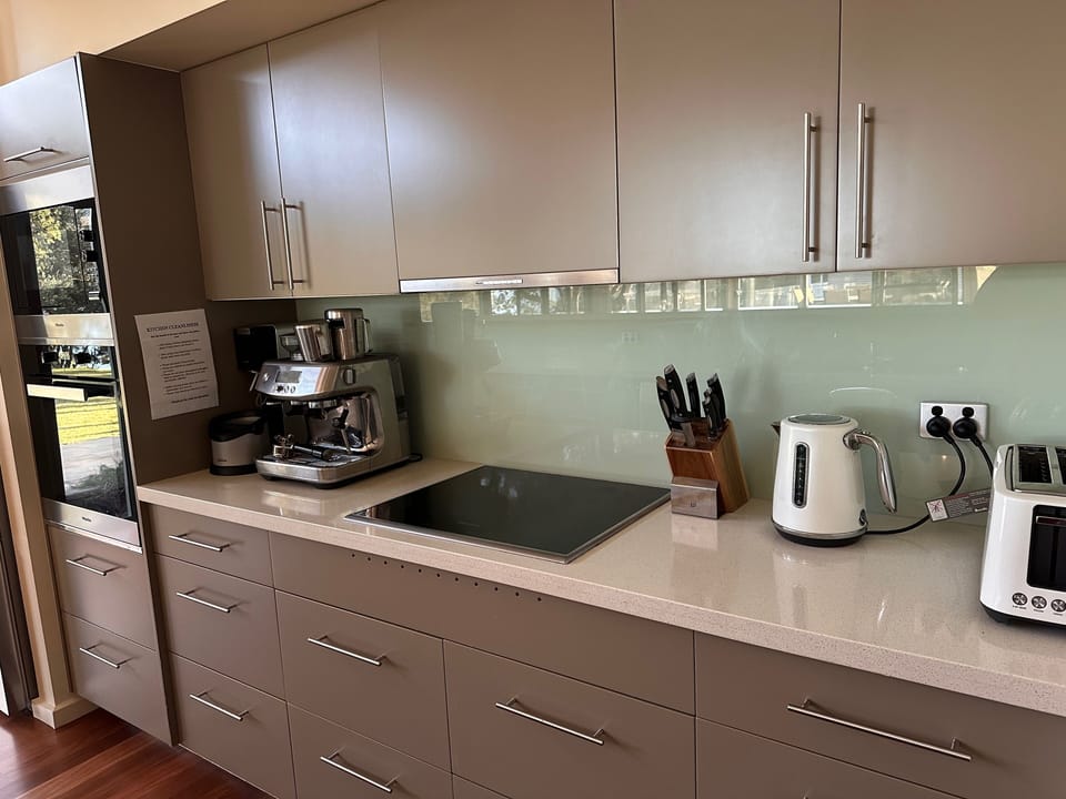Kitchen well equipped with separate pantry and an array of foods and spices