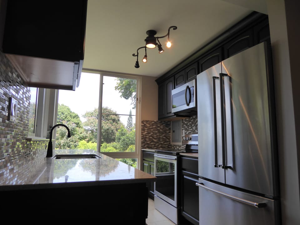 Side A - Kitchen with refrigerator,stove,oven,toaster,coffee maker,blender, ect.