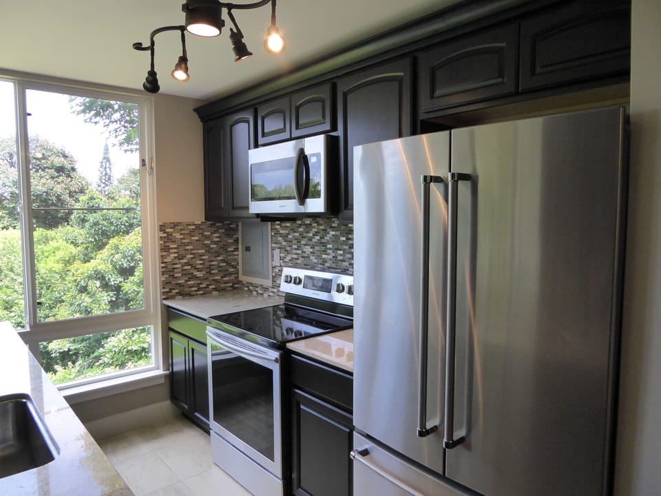 Side A - Closeup of Kitchen & all new appliances; OR Cook on Resort BBQ Grill.