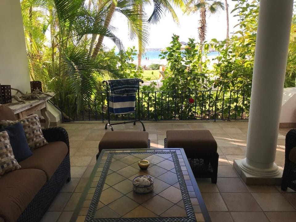 Outdoor Patio seating with a comfortable couch, 2 comfy chairs, off Master Suite