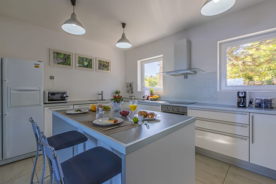 In the kitchen are dishes, utensils, all kinds of glasses, herbs, spices...