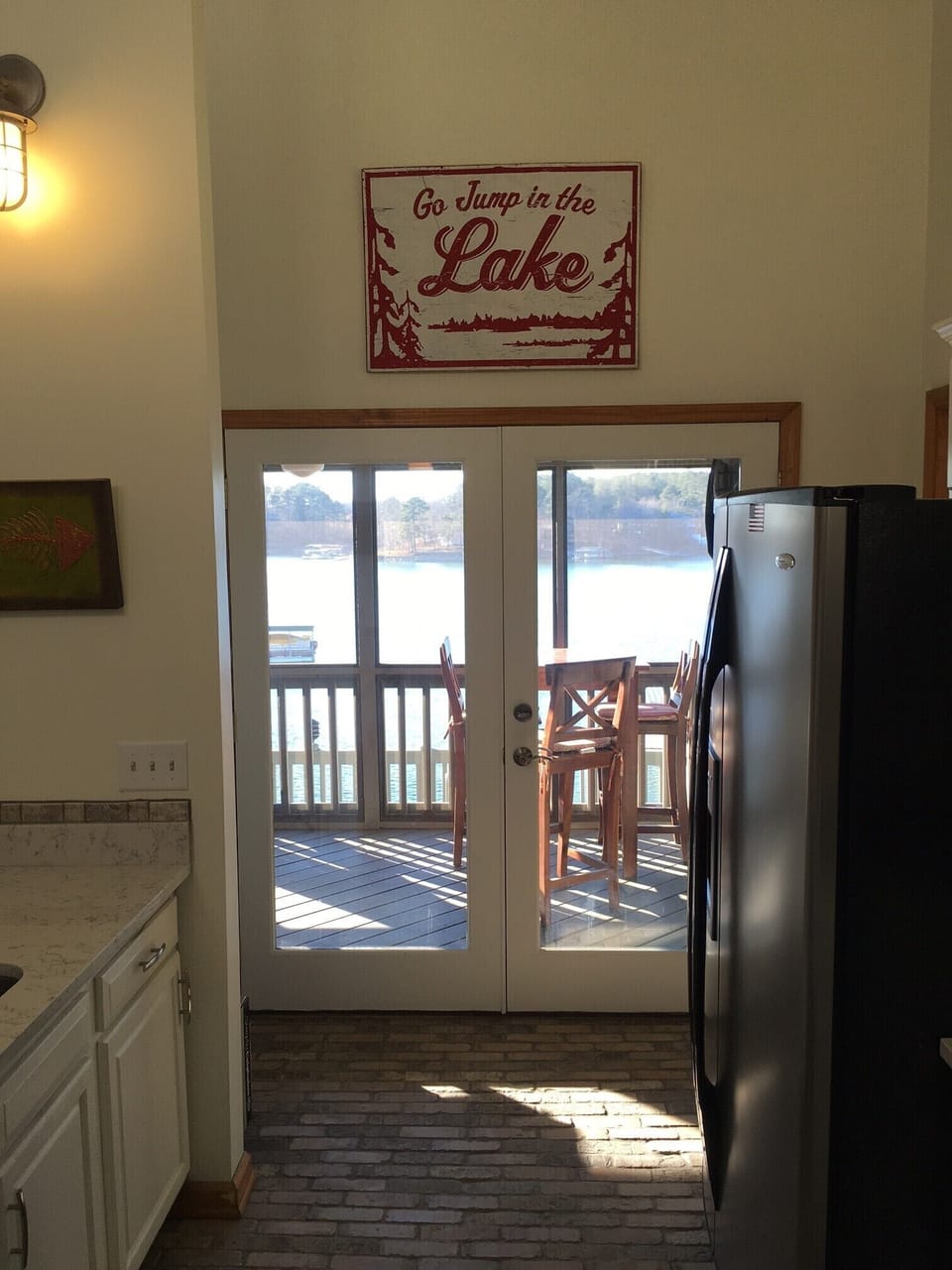 View from kitchen to screened porch. 