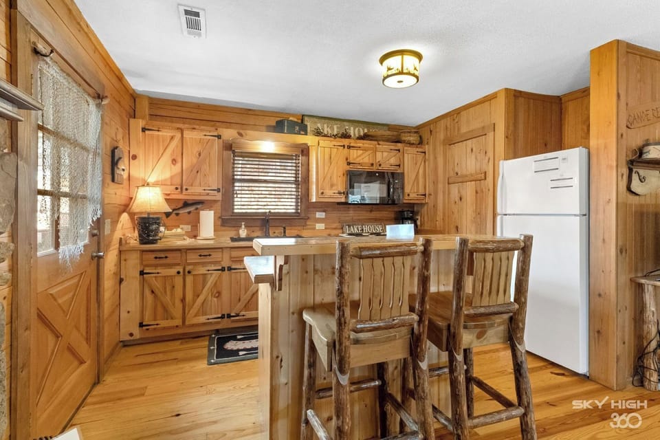 View of Lake House kitchen and entrance to back deck.