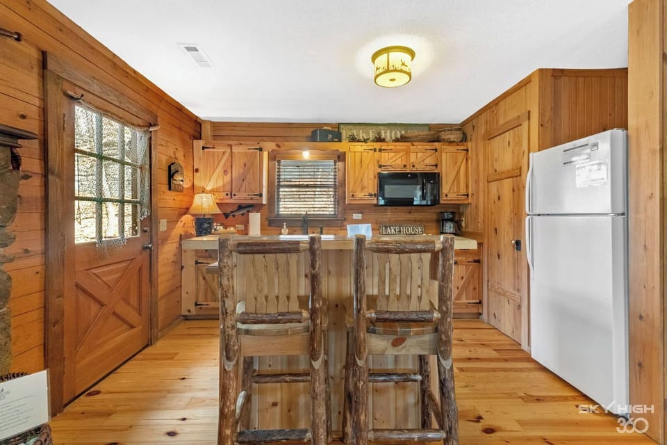 View of the kitchen bar and entrance to back deck.