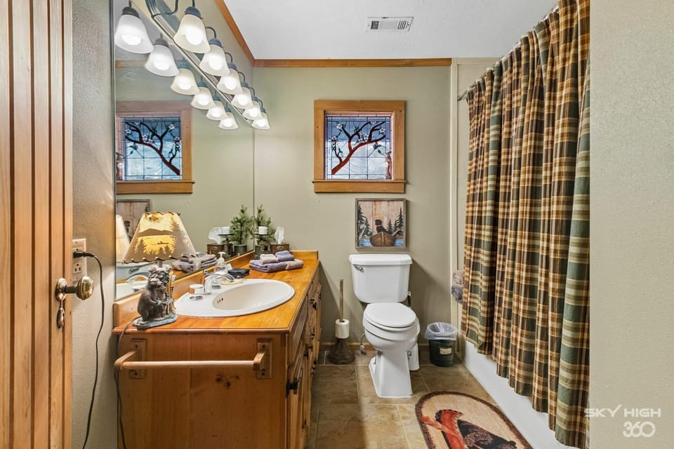 View of bathroom with jacuzzi tub and shower.