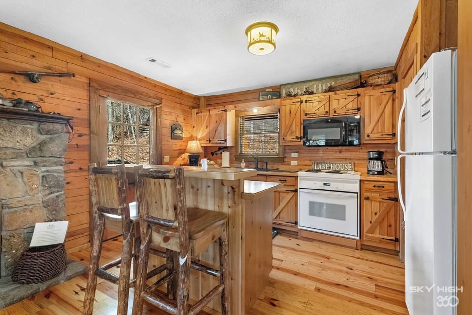 Kitchen is equipped with basic cleaning supplies, cookware, dishes, utensils, coffee and tea with creamer and sweeteners, salt and pepper, and cooking oil. All you need to bring is the groceries!