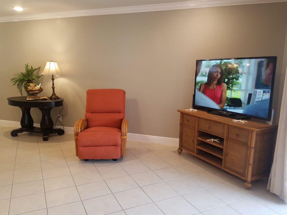 Living room with large flat screenTV.