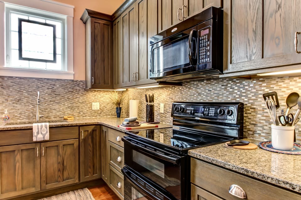 Double oven smooth top range, french door refrigerator and dishwasher.