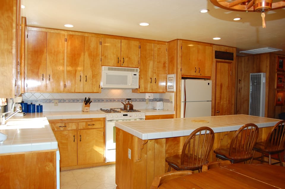 Kitchen with generous bar seating for 3.
