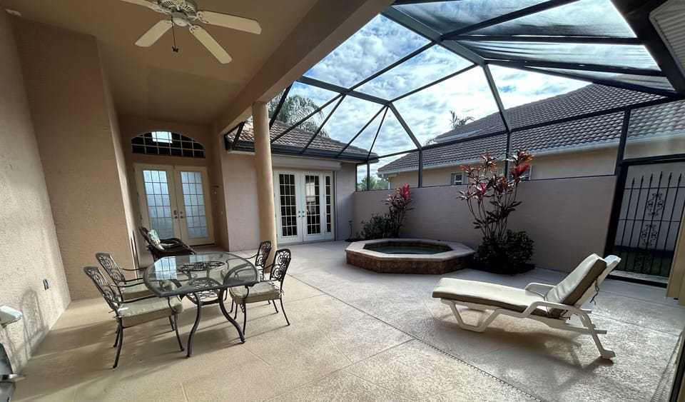 Court yard - table with chairs, hot tub, chairs & lounge chair