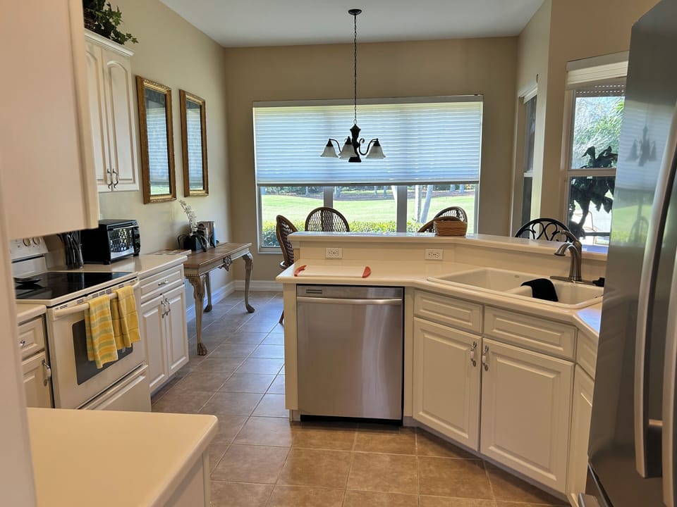 Kitchen - round table with 4 chairs & 2 counter top chairs w/ gulf course view