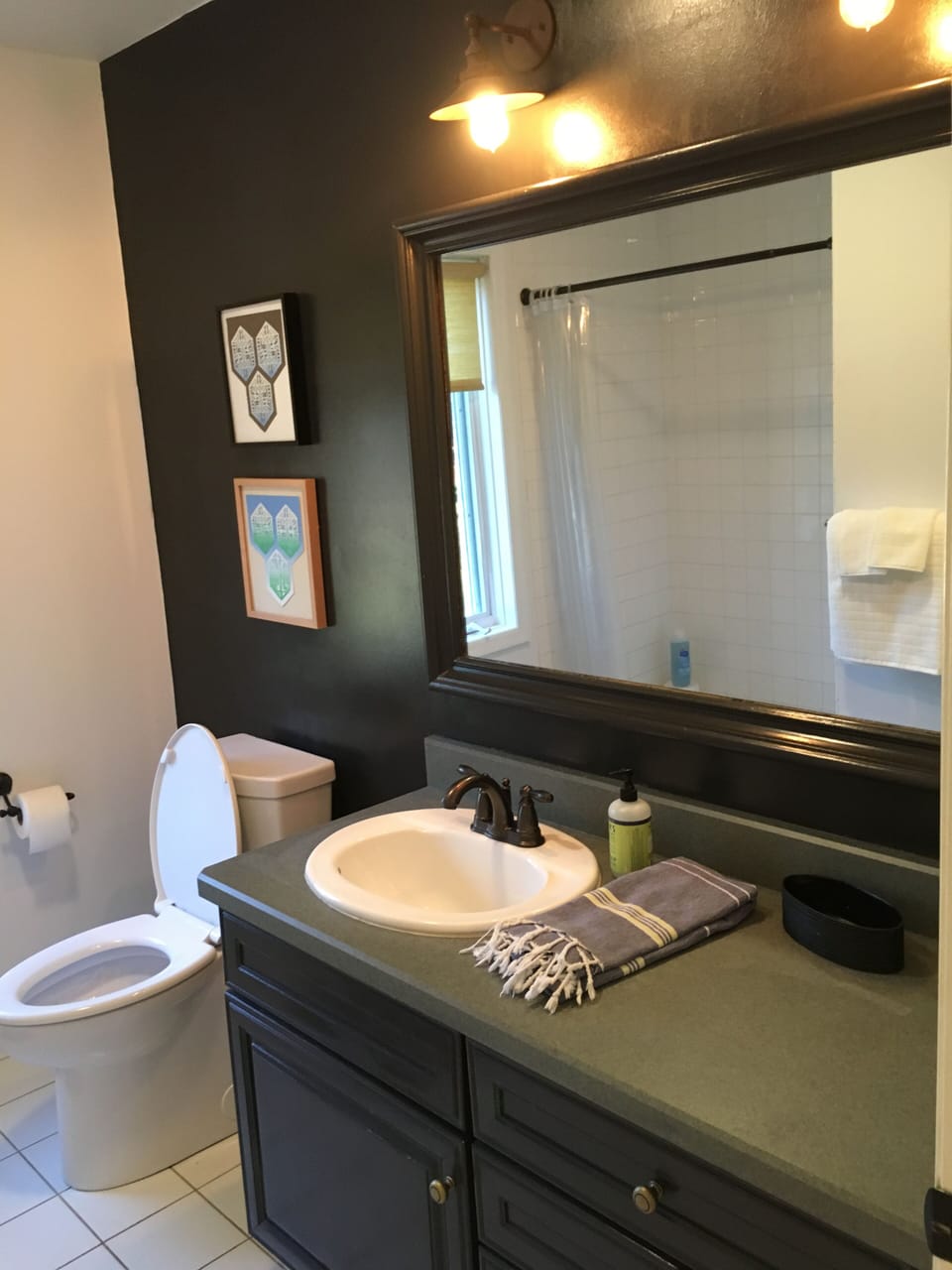 Downstairs bath has roomy shower, extra-wide vanity & plenty of fresh towels