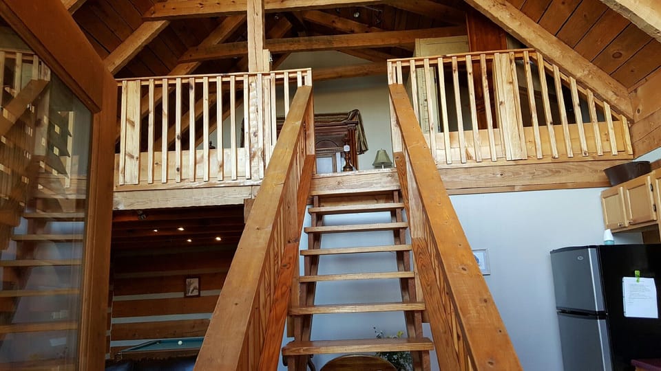 Loft bedroom with half bath and king bed