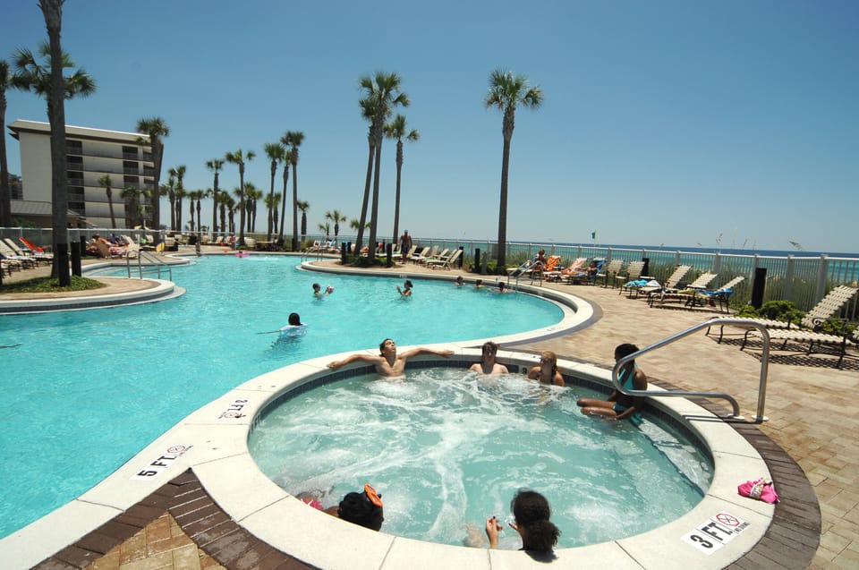 Tropical beach front pool, Jacuzzi, and kiddie pool. 