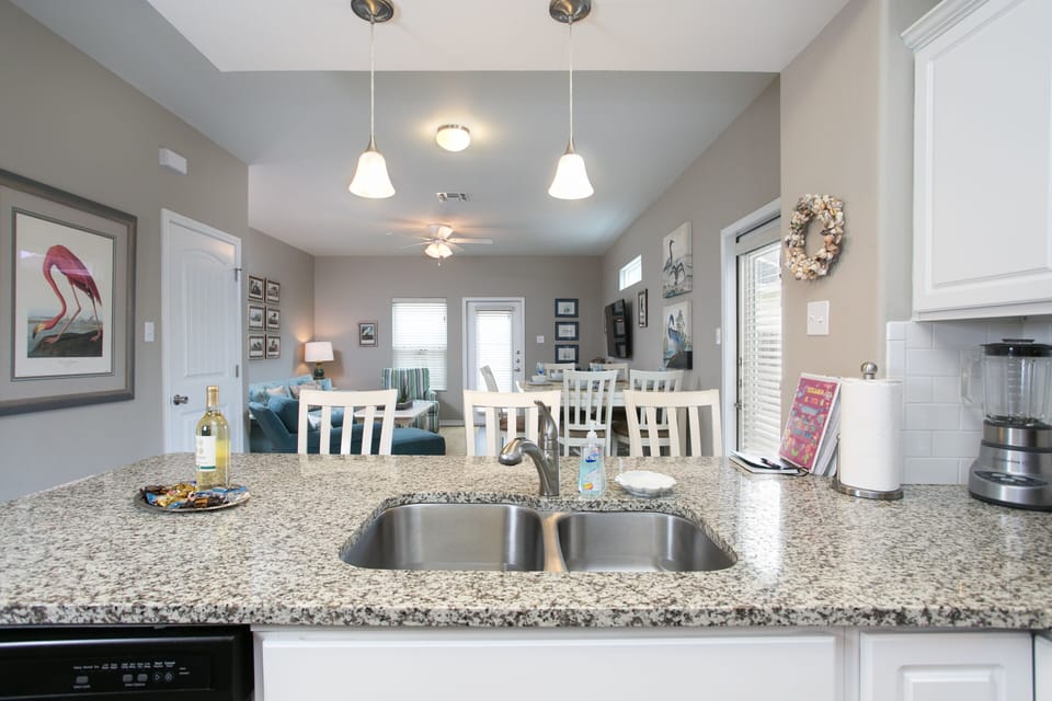 Kitchen and bar area entertain while cooking