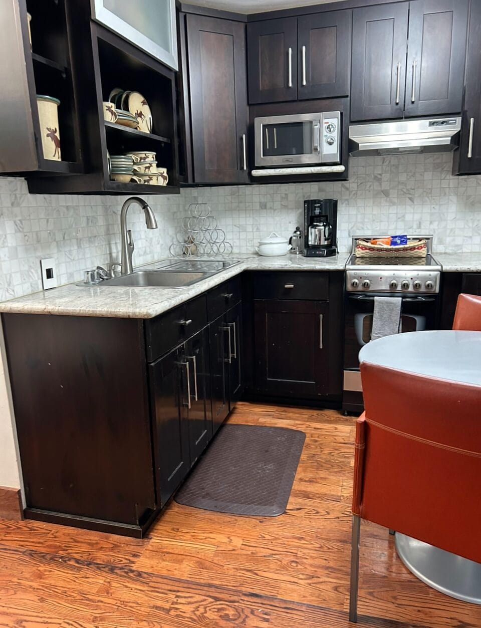 Spacious kitchen including plenty of storage with an eat in or mobile work table