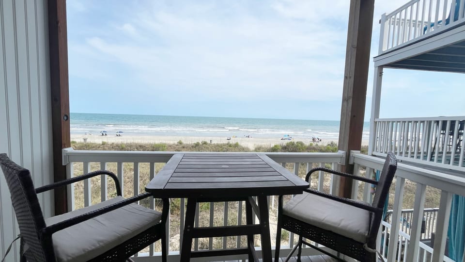 Balcony off of living room with direct ocean view.