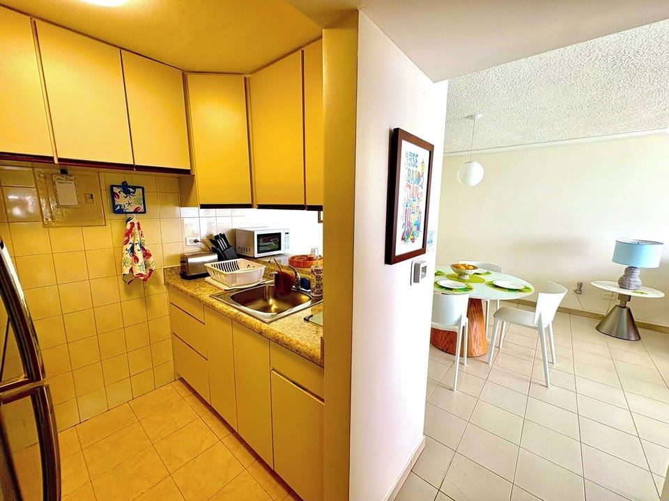 Fully equipped kitchen looking out to dining.
