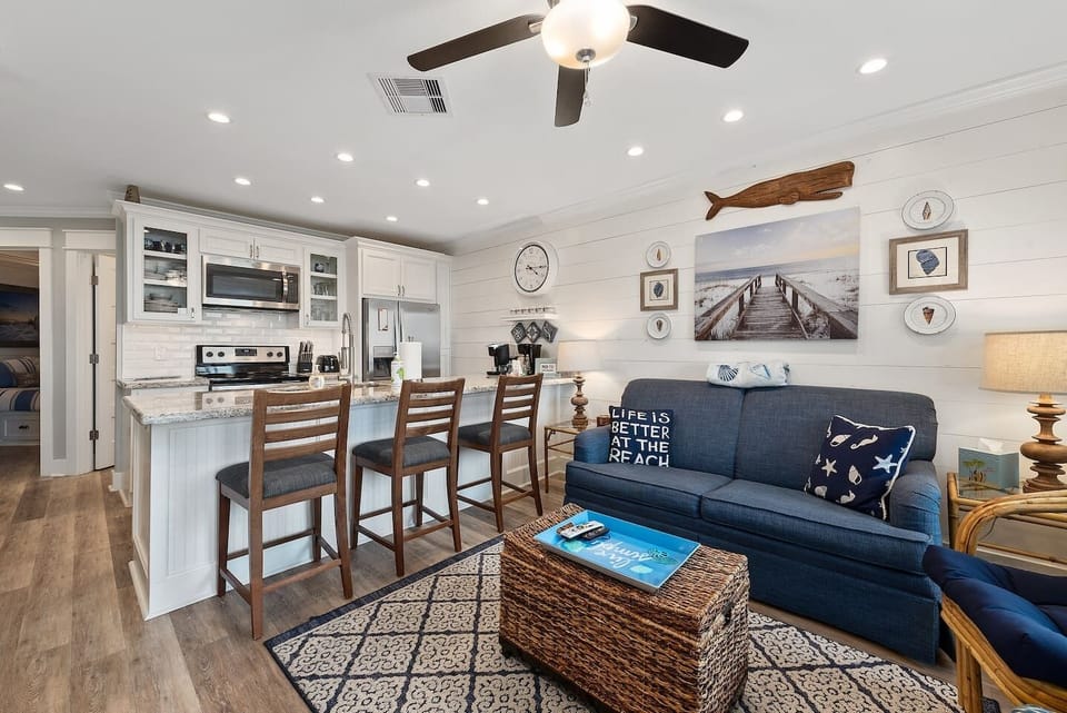 Dining area is a counter height bar with seating for 3.