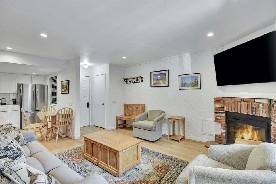 Living Room with Large Flat Screen TV and Electric Fire Place