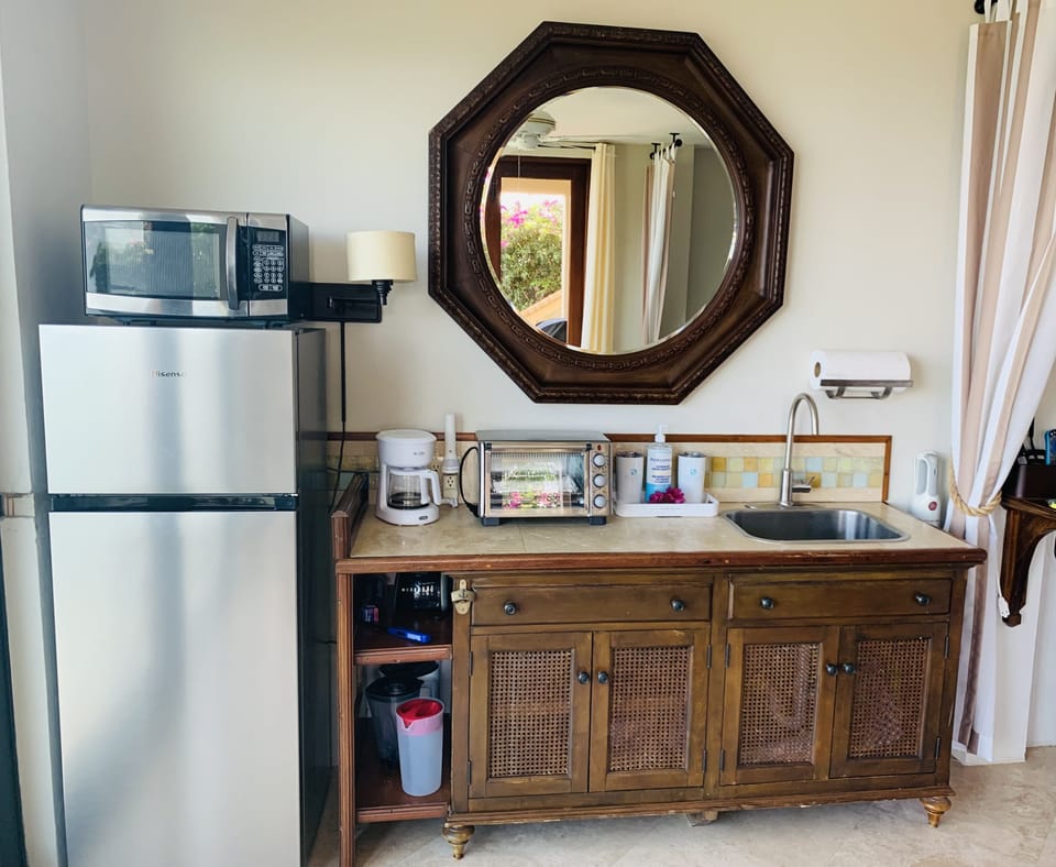 Everything you need to cook a meal. 7 cu ft fridge big enough for groceries.