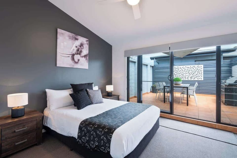 Master Queen bedroom opening up onto a private courtyard with BBQ in the Nautilus Jervis Bay holiday rentals.