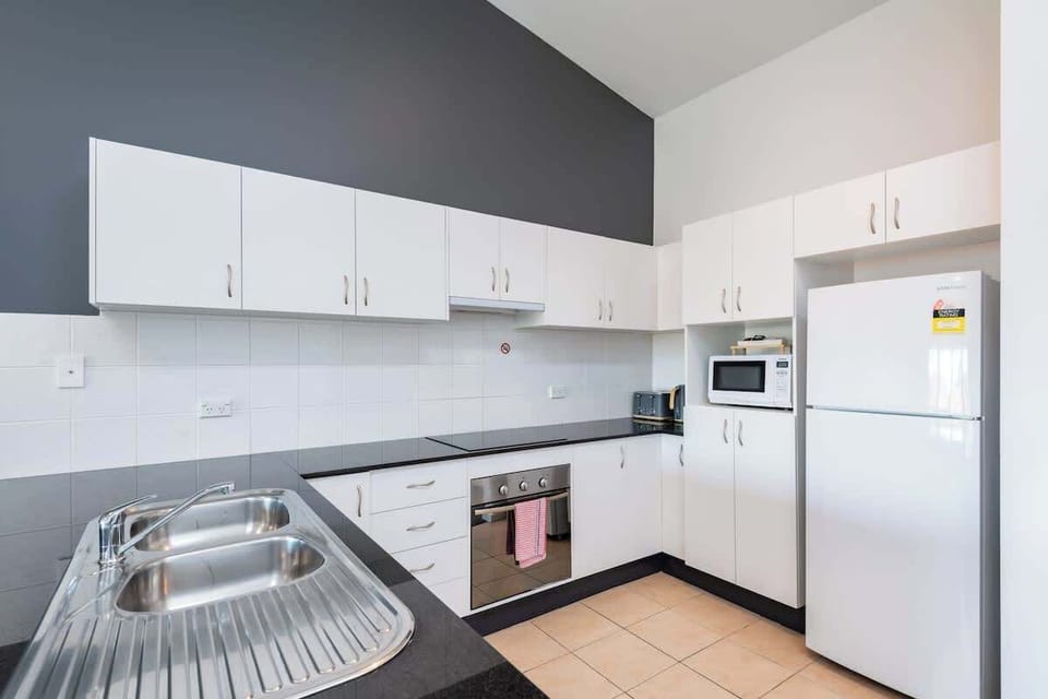 Full kitchen  with dishwasher, oven and cooktop in Greenfields apartment at Nautilus Jervis Bay holiday rentals.