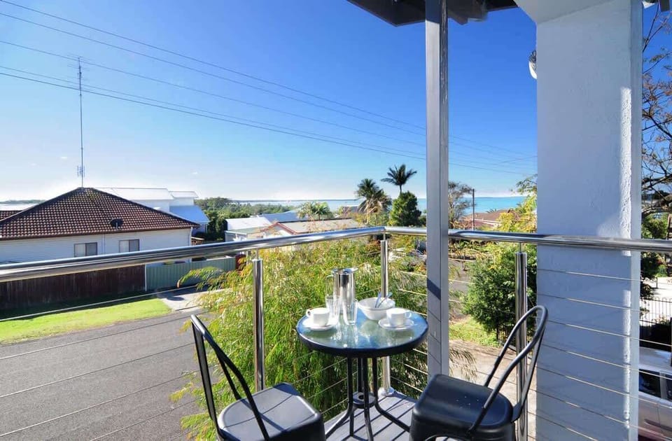 Balcony off the lounge room with water views in the Greenfields apartment of Nautilus Jervis Bay holiday rentals.