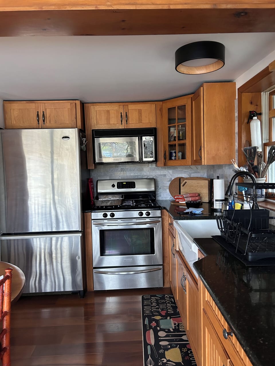 Stainless appliances in the open kitchen/living area.