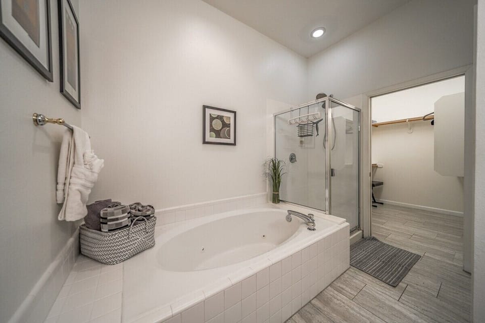 Primary Bathroom Jetted Tub and Shower private water closet and walk-in closet