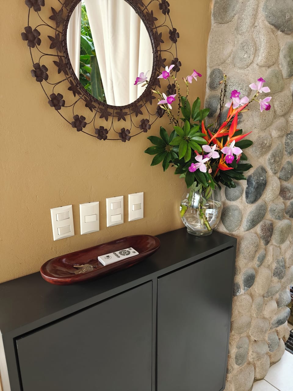 Keys, dining room ceiling fan remote.    Games are housed inside the cabinet.